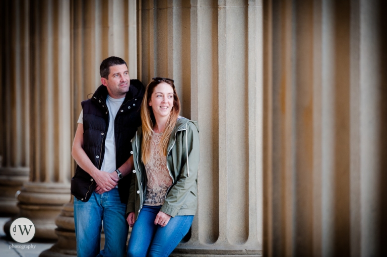 Couple leaning against St Georges hall pillars