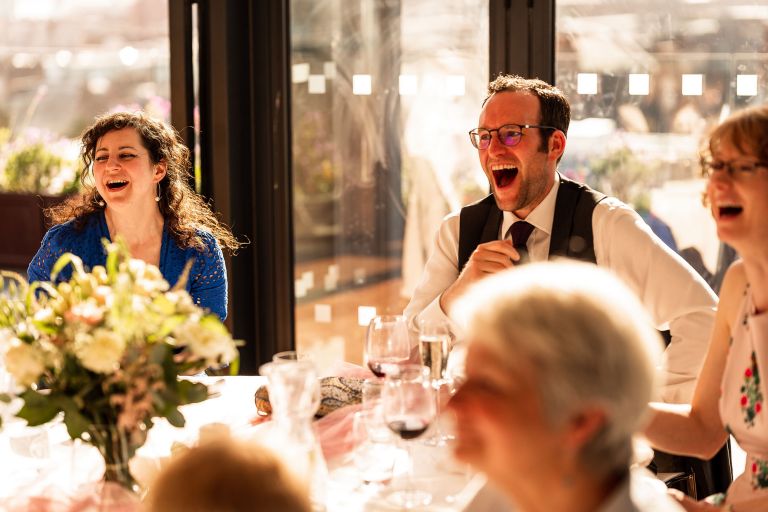 Guests laugh at the speeches