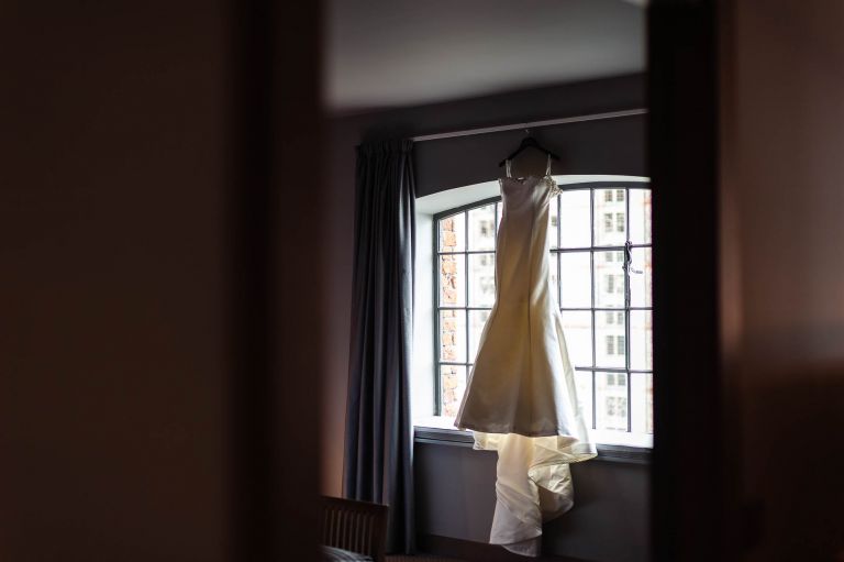 brides wedding dress in window