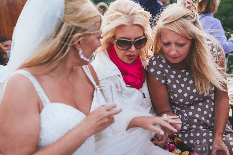 Bride shows her ring to guests
