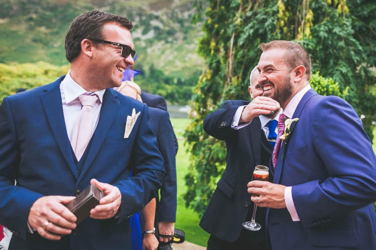 Guest shares a joke with groom