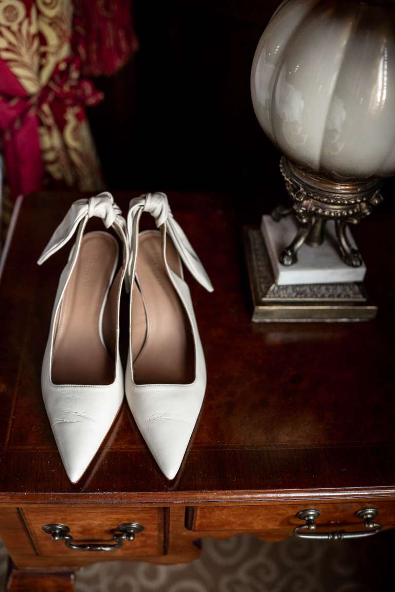 Brides shoes on bedside table
