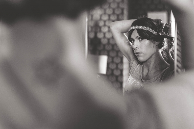 Bridesmaid looking in mirror