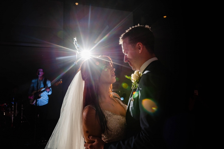 bride and groom look int each other's eyes during the first dance