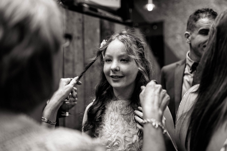 a guest plays with a young girls hair