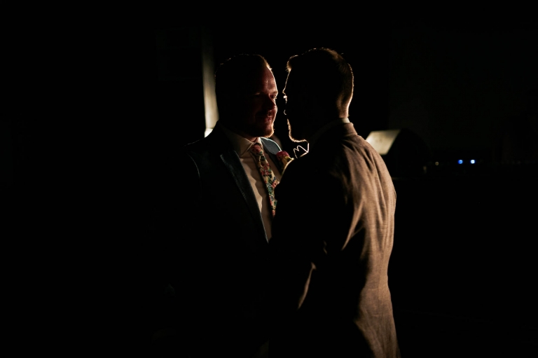 Luke & mike silhouetted during the first dance