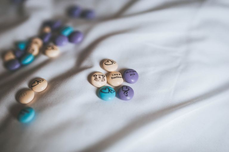 M&M sweets on bed