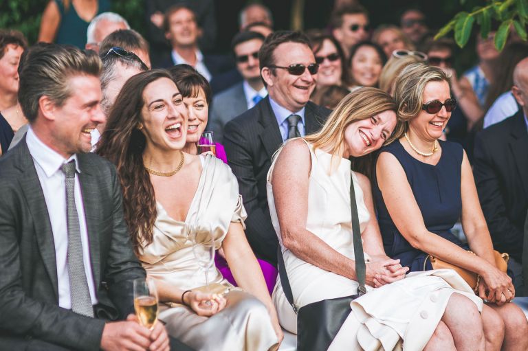Guests laughing during ceremony
