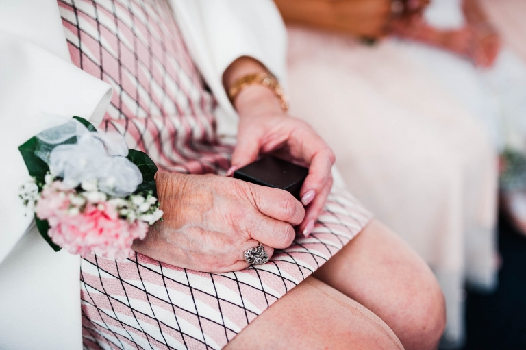 Mother of the groom holding the wedding rings