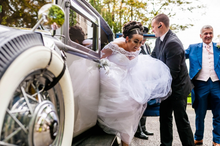 bride exits the wedding car