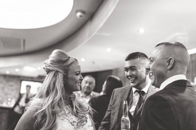 bride sharing joke with guests