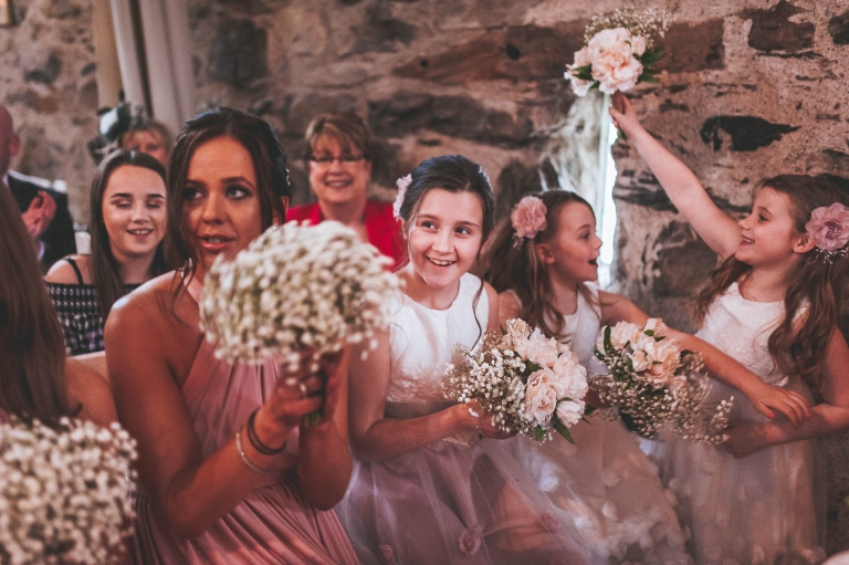 bridesmaids and flower girls cheer