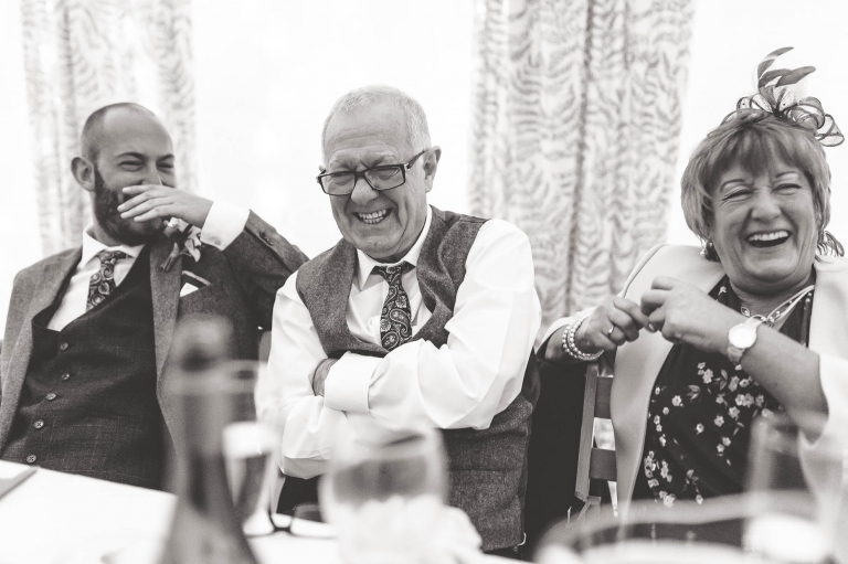 Mother and father of the groom laugh at best mans joke