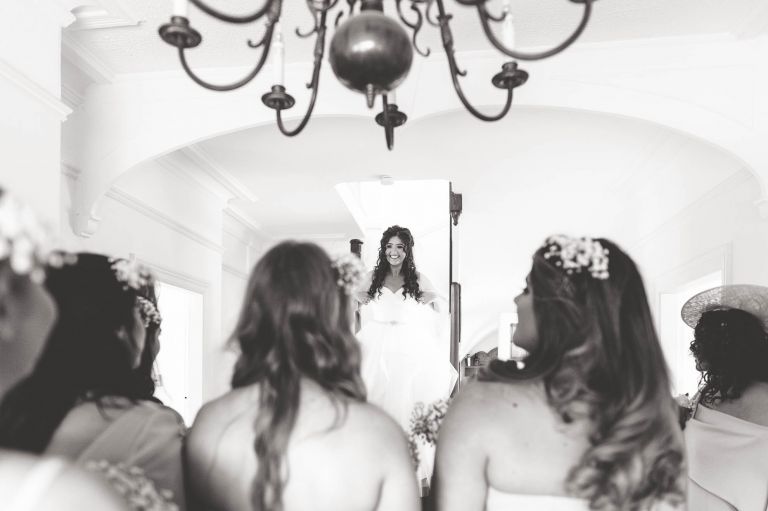 Bride enters the room in her dress
