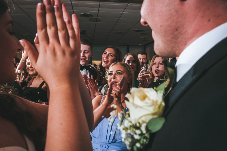 Guests cheer bride and groom