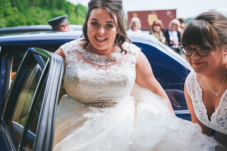 Bride arrives at the church in the wedding car