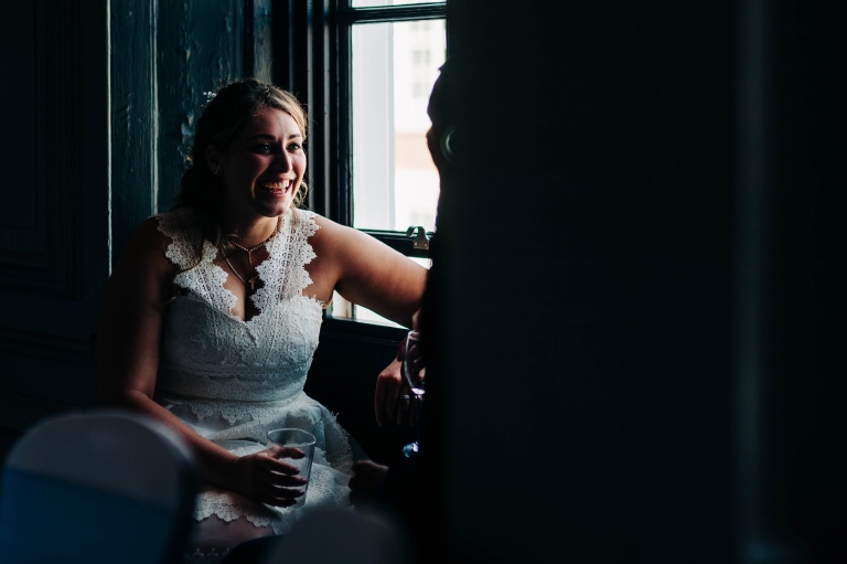 Bride shares a joke with the groom