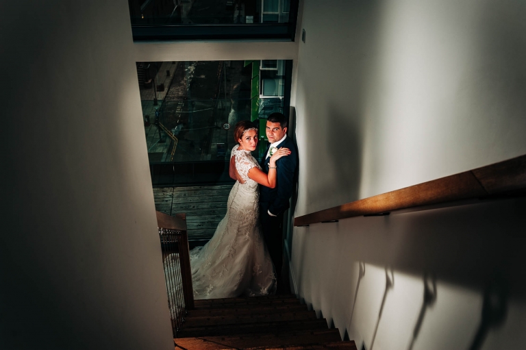 Bride and groom portrait on staircase of Hope Street hotel