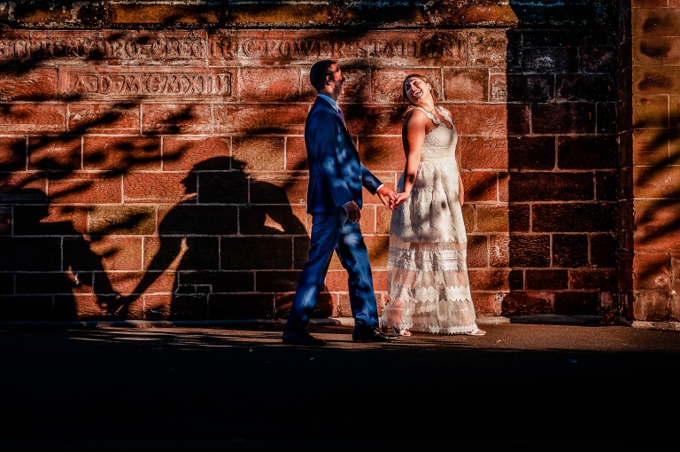 Bride and groom walking in sunset