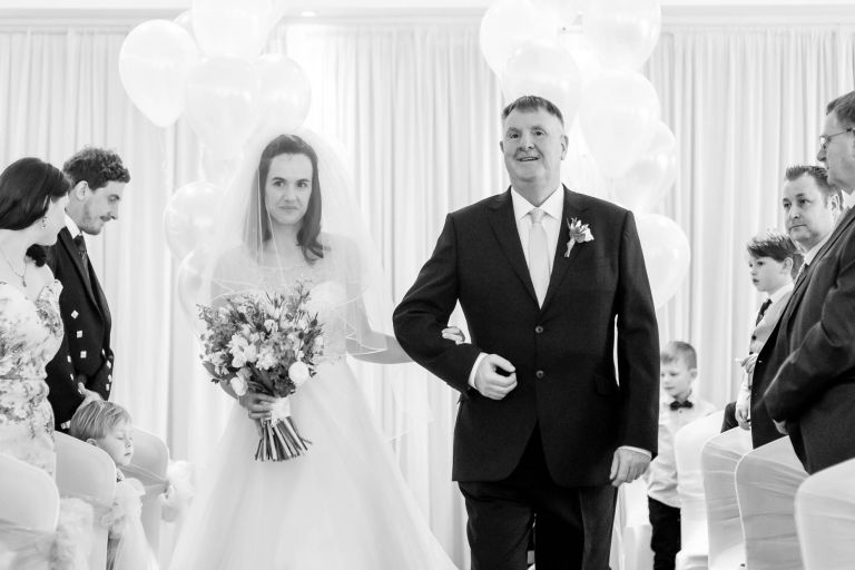 Bride walks up the aisle with her father