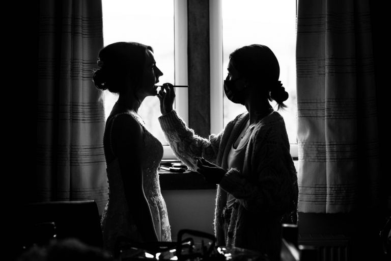 Bride has her make up touched up