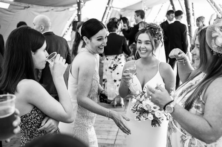 Bride shares a joke with guests