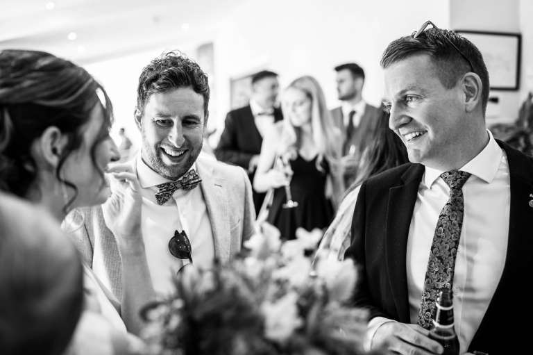Guests share a joke with the bride