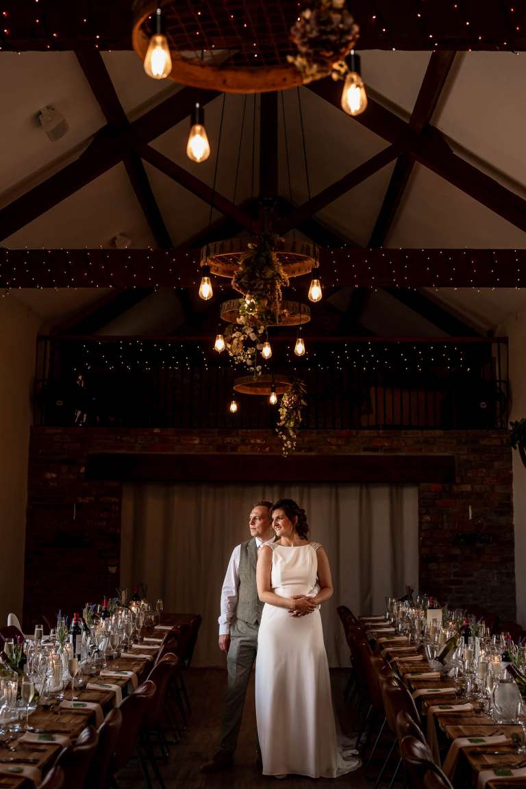 Portrait of bride and groom in The Barn