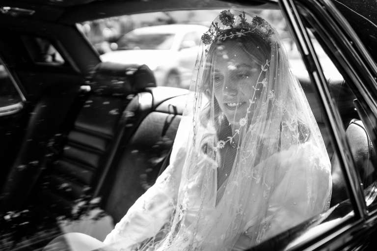 Bride arriving at church in wedding car