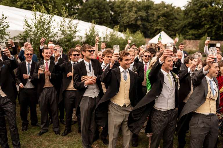 Guests toast the happy couple after best mans speech