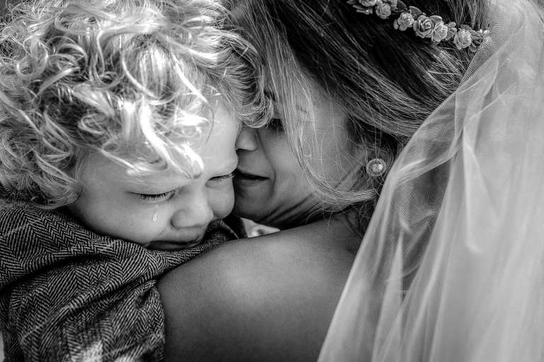 The bride comforts her son who just watched his mum walk back down the aisle without him!!